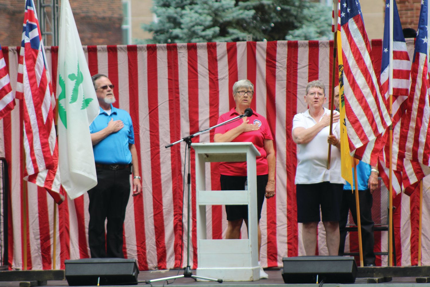Members of the local Eagles Aerie conduct a flag ceremony and lead the crowd in the Pledge of Allegiance on Friday to open the annual Crawfordsville Strawberry Festival. The festival continues with live entertainment, food, arts and crafts and children’s activities 11 a.m. to 10 p.m. Saturday and 11 a.m. to 4 p.m. Sunday at Lane Place, 212 S. Water St.